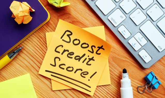 Post-it note with "Boost credit score" written on it.
