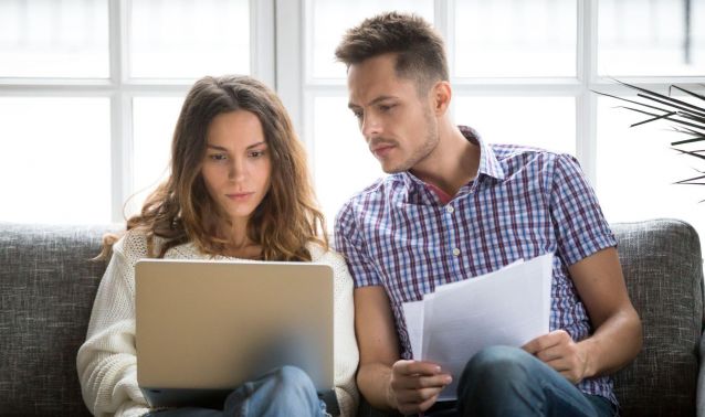 Man and woman looking at laptop.