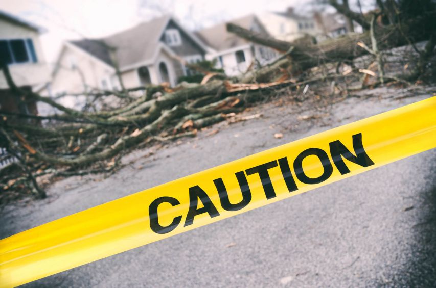 Caution tape in front of storm damage