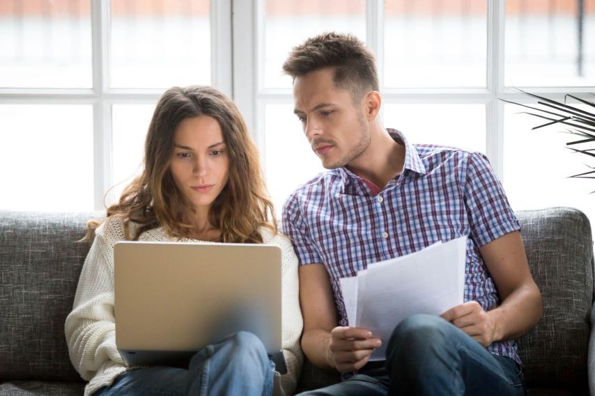 Man and woman looking at laptop.