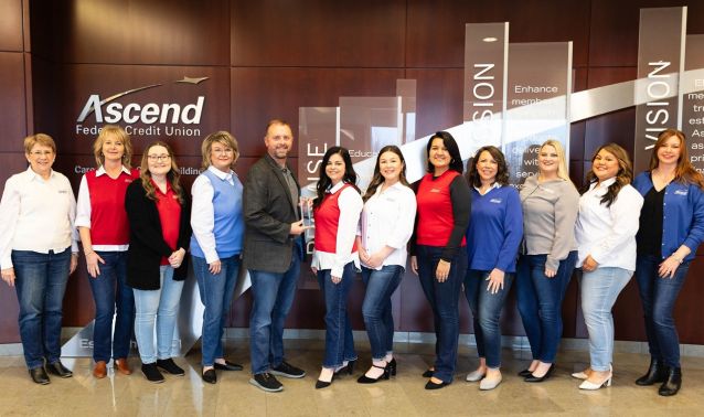 Ascend's human resources department poses with the APEX training award