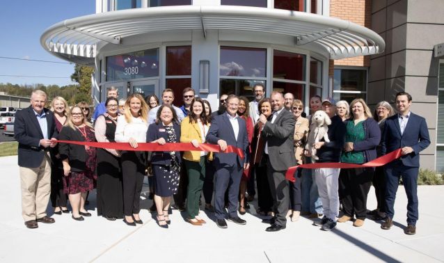 Photo of ribbon cutting ceremony to celebrate the opening of a new Ascend branch