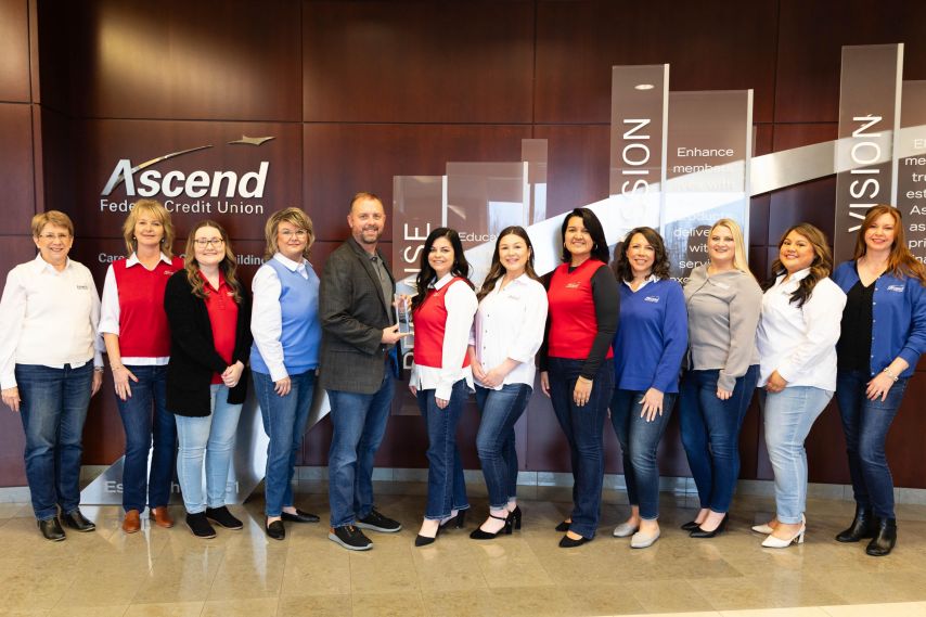 Ascend's human resources department poses with the APEX training award